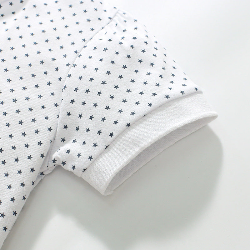 Girls' short-sleeved cotton polo with strawberry polka dots
