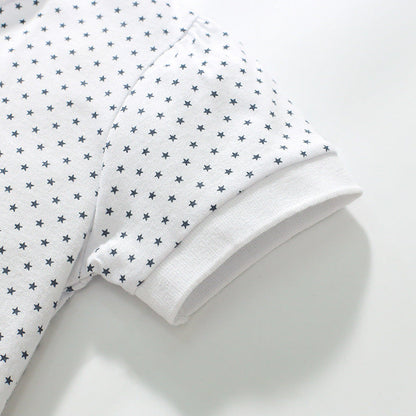 Girls' short-sleeved cotton polo with strawberry polka dots
