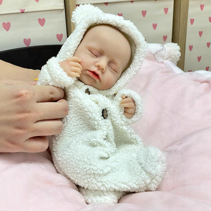 30cm Lifelike Full Silicone Closed Eyes Reborn Doll Girl In White plush clothes