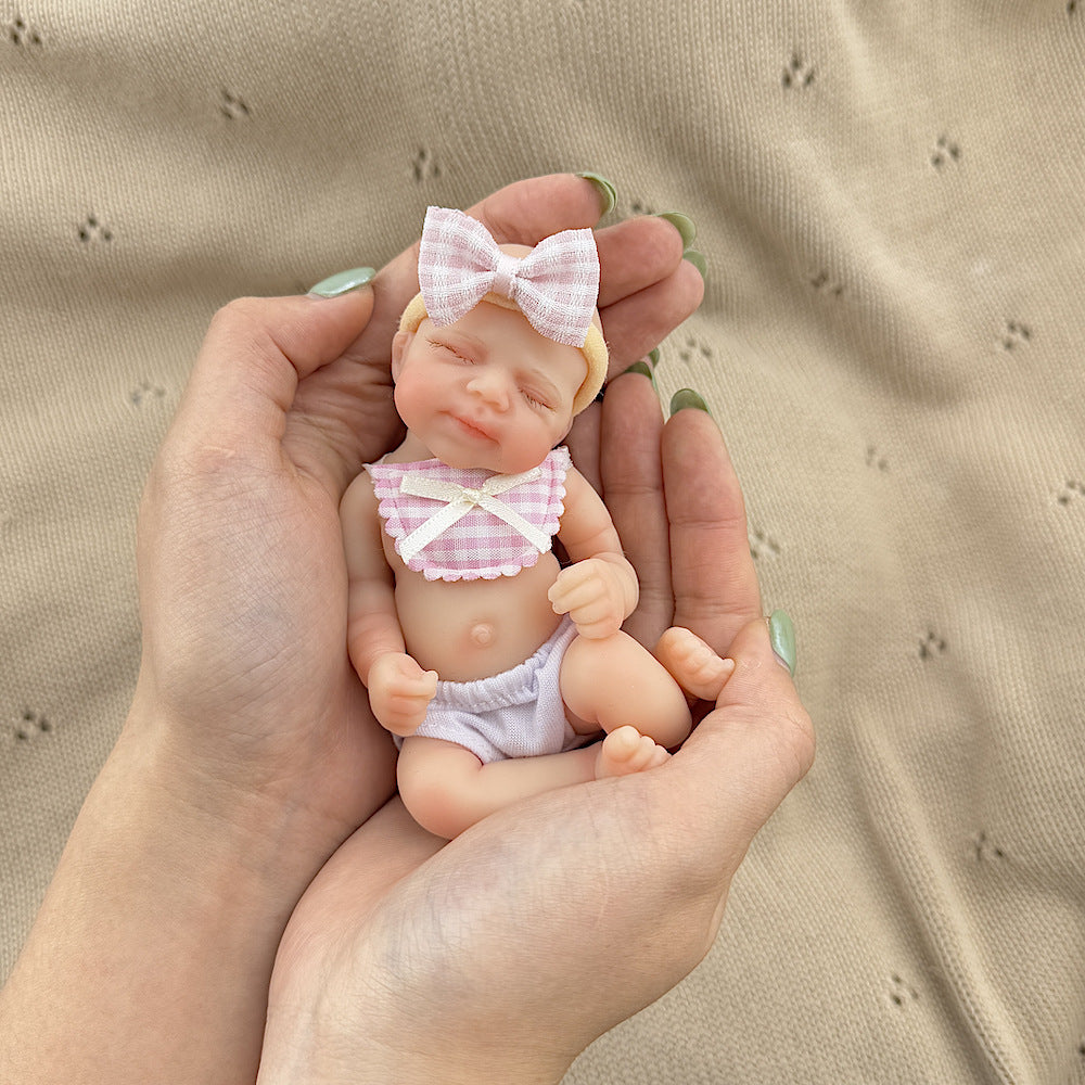 15cm Silicone Closed Eyes Pascale Mini Reborn Doll in Pink Plaid Bib