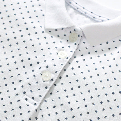 Girls' short-sleeved cotton polo with strawberry polka dots