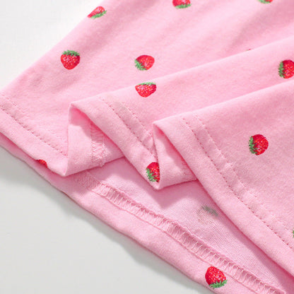 Girls' short-sleeved cotton polo with strawberry polka dots